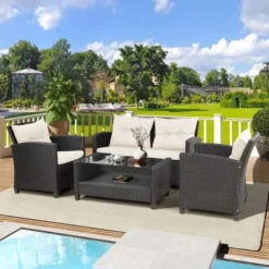 Elegant Black Rattan 4-Piece Outdoor Sofa Set with Cream Cushions & Glass Table – Durable, Comfortable & Easy to Maintain